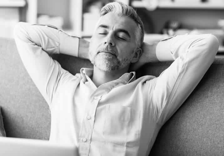 Guy Relaxing On Sofa